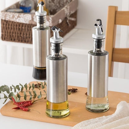 1 Glass Oil Bottle with Nozzle Head – 300ML Stainless Steel Case